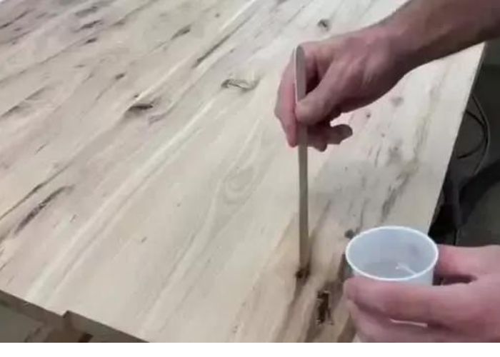 Fill up the cracks in wood with epoxy